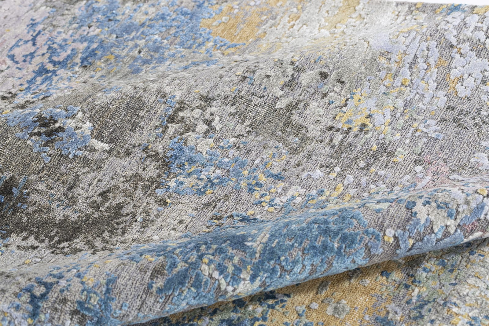 detail image of Niche Charcoal hand knotted area rug design by Tufenkian